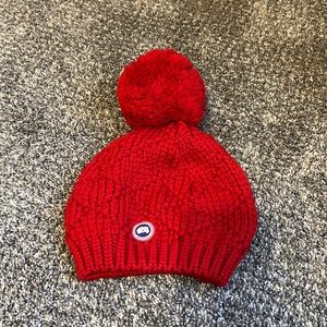 Canada Goose red beanie hat.
